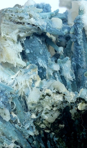 Blue coral Chalcedony covering scolocite + okenite, mordonite,  calcite